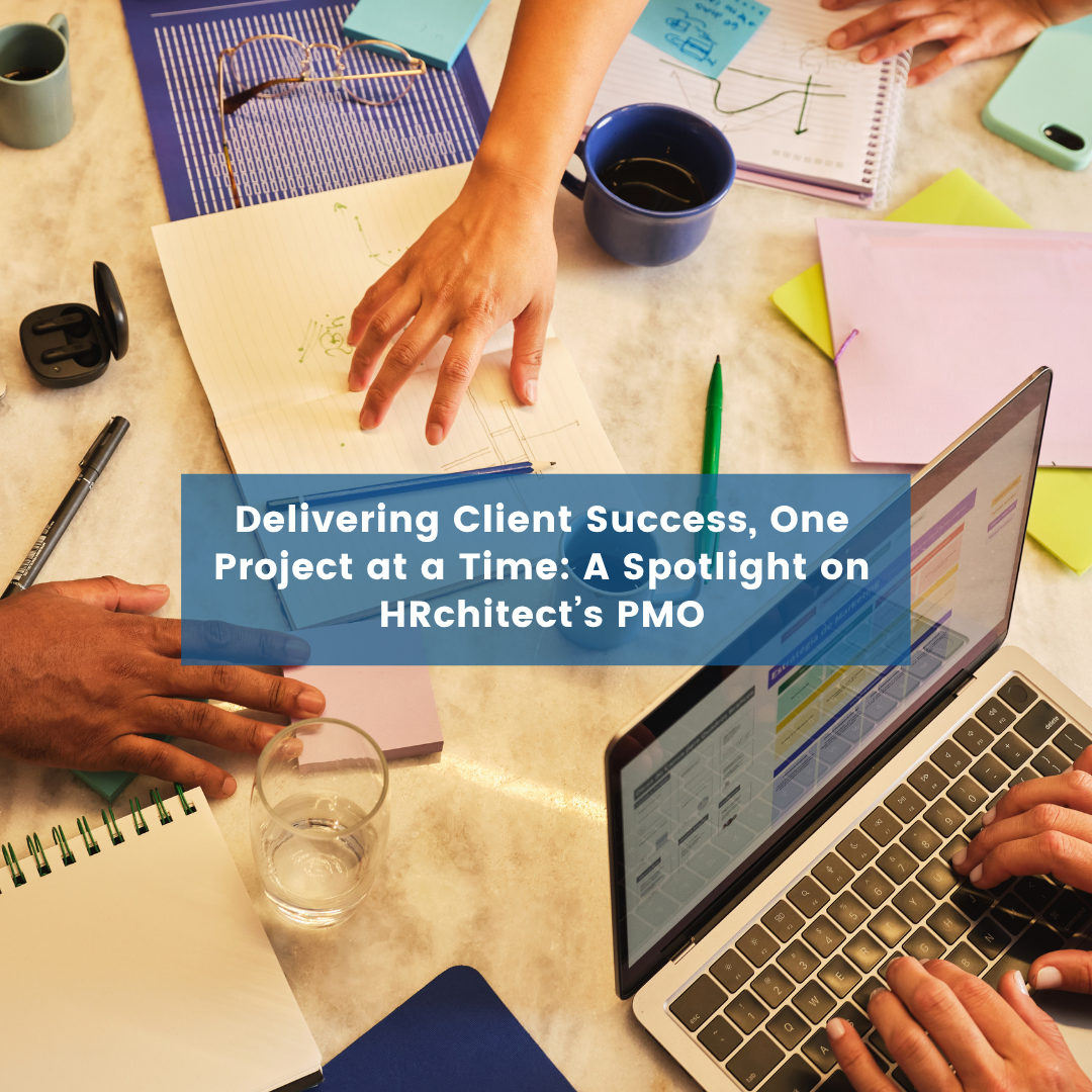 Delivering Client Success, One Project at a Time A Spotlight on HRchitect’s PMO Blog Post Cover Aerial view of a desk where people are working